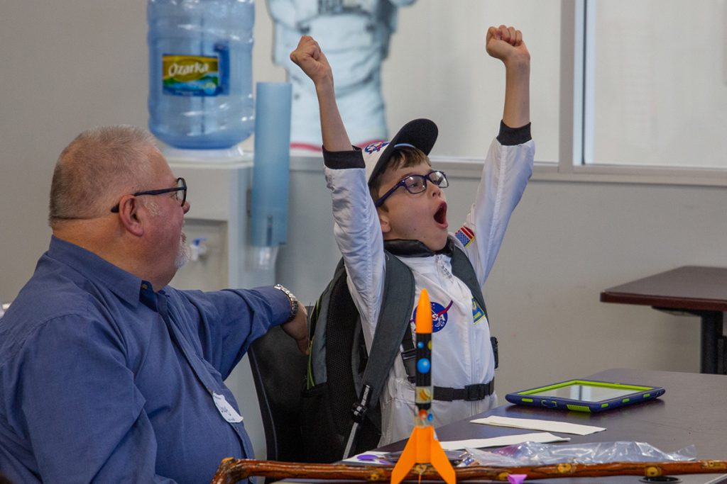 Child celebrates in Explorer Camp