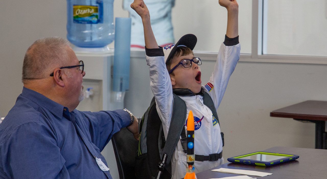 Child celebrates in Explorer Camp