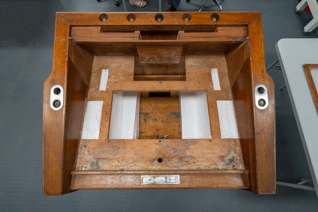 View of the top of the lectern after Pine completed his conservation efforts. Photocopies of President Kennedy’s speech and handwritten notes rest on the lectern’s desk. / Photograph by Aaron Rodriguez